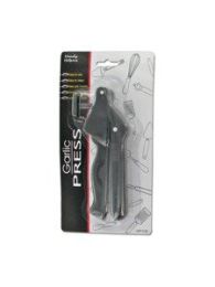 Garlic press with cleaner